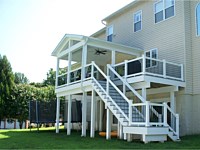 <b>Beautiful covered deck with fascia warpping the deck and vinyl wrapped support beams and posts</b>